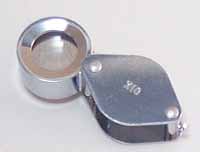 Metal folding magnifier