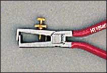 Wire stripping pliers 160mm with    red PVC handles.